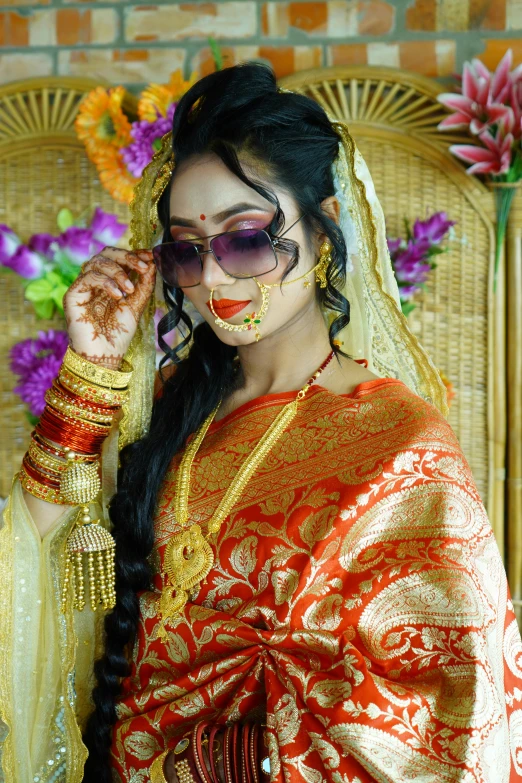 woman in indian outfit with traditional makeup painted on her face