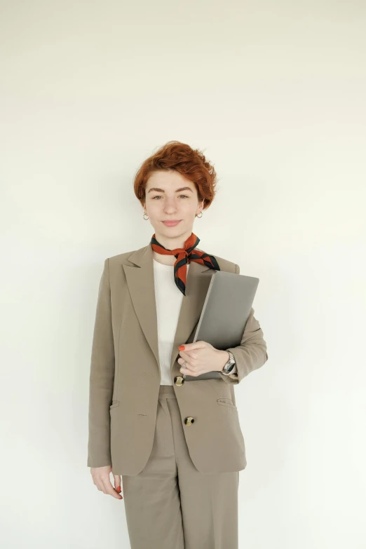 the girl is dressed in a suit and with red hair