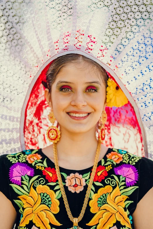 the young woman is dressed in traditional garb