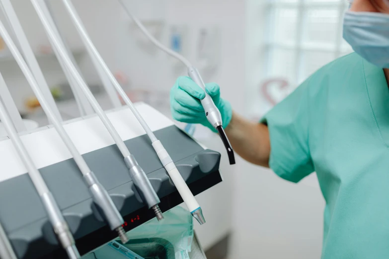 a nurse holds onto a pen in a machine