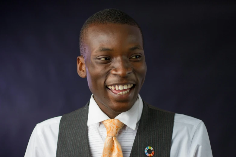 young man wearing orange tie and on up shirt