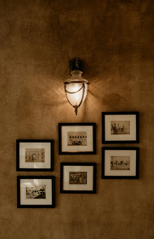 there is a po on the wall and there are pictures and lamps