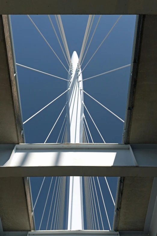 view from below of an open bridge on a sunny day