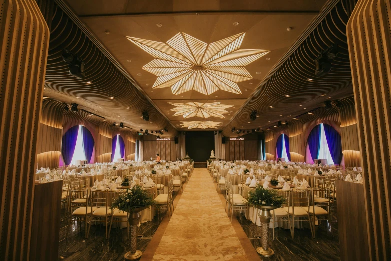 the large banquet hall has decorated tables and chairs