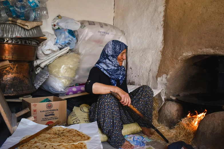 a woman in the kitchen is preparing soing to cook