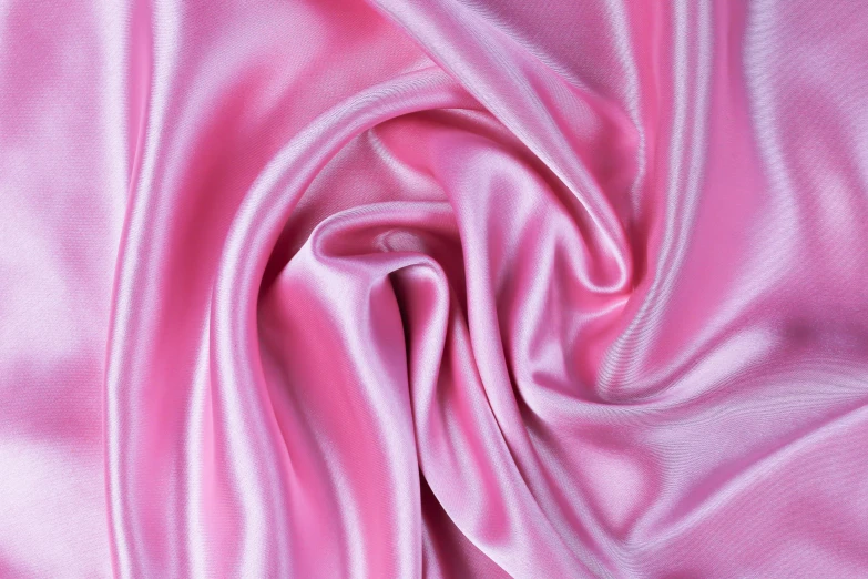 a bright pink fabric with an irregular pattern