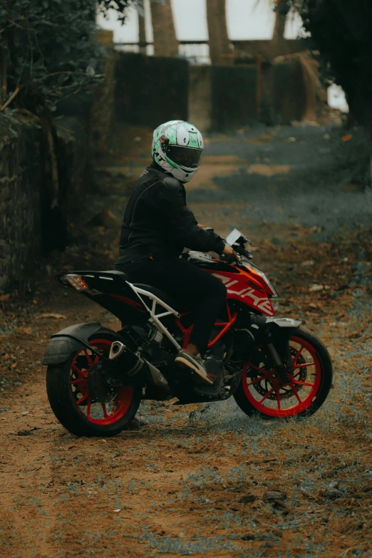 a person on a dirt motorcycle on a trail