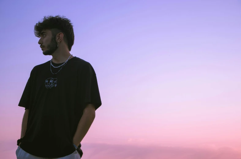 a man is posing at sunset with a frisbee in his hand