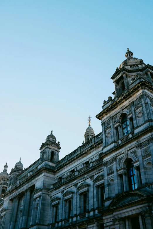 a blue sky is seen behind the old building