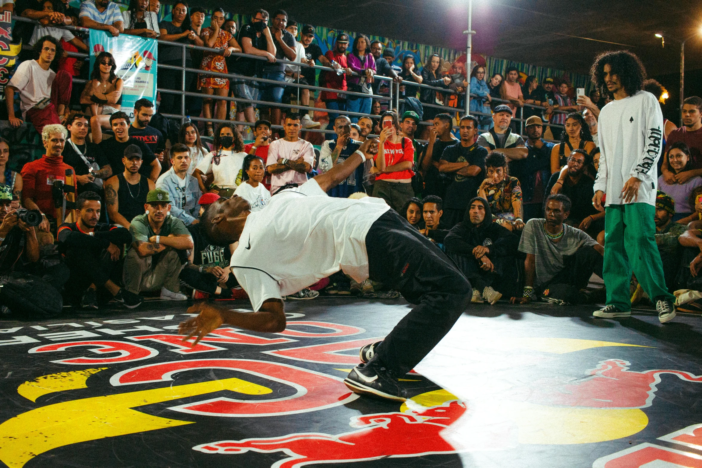 a person is doing tricks on a skateboard while a crowd watches