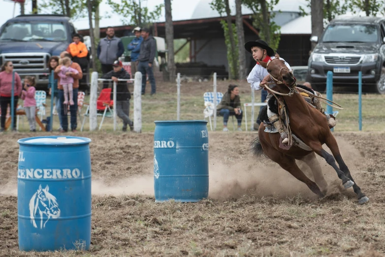 a man riding on the back of a brown horse