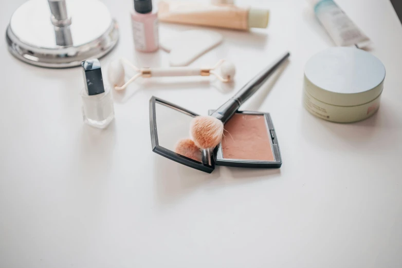 makeup on a table with other items around