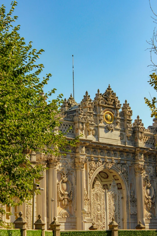 the view from the ground of an ornate building