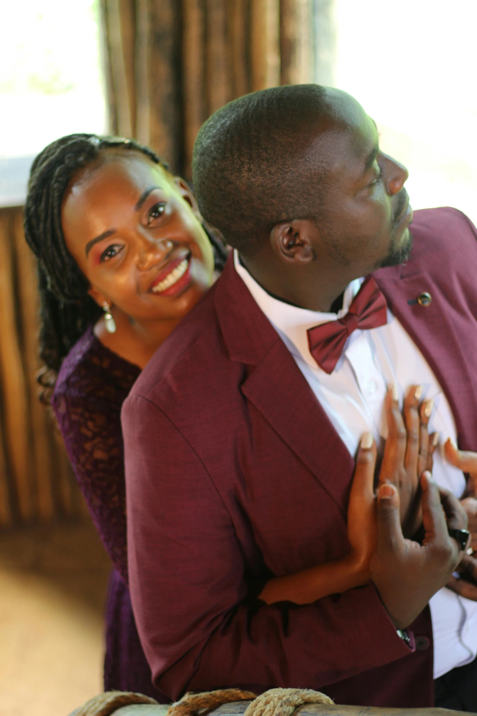 a man and woman are posing for a picture