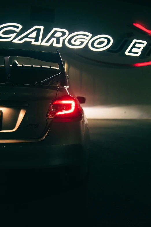 the rear of a car parked in a garage