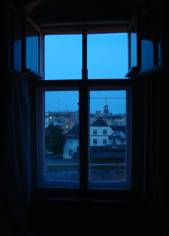 a view of a city through a window at night