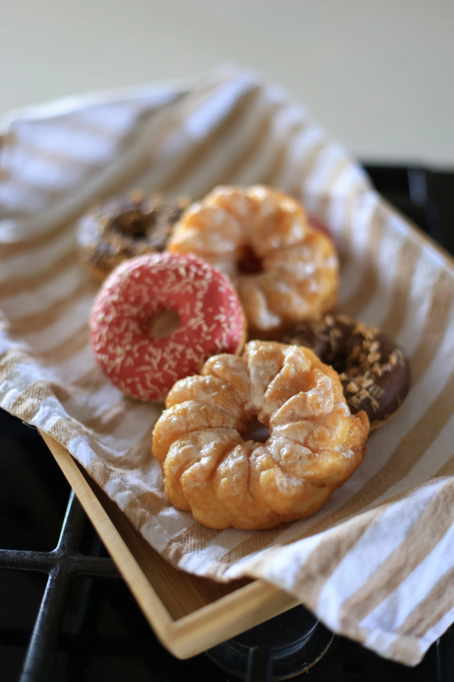 a basket filled with donuts sitting on top of a stove