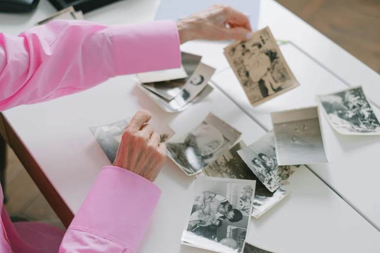 woman at a table with multiple pos in front of her