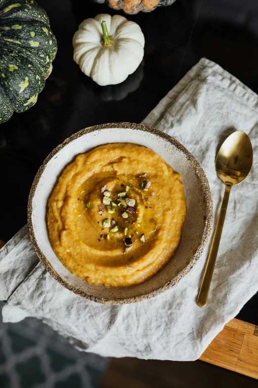 a table set up with an assortment of pumpkin dip