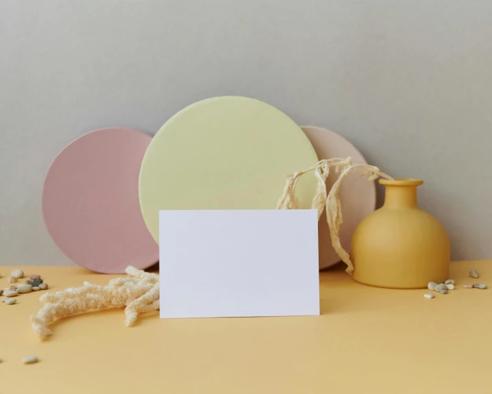 three blank cards and some decorative objects on the table