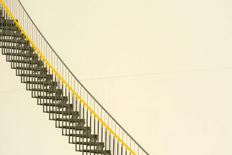 there is a very long yellow metal stairway