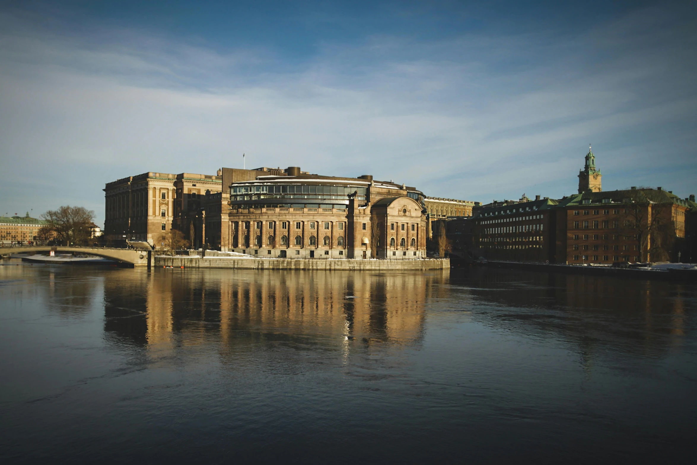 a very big building that is by some water