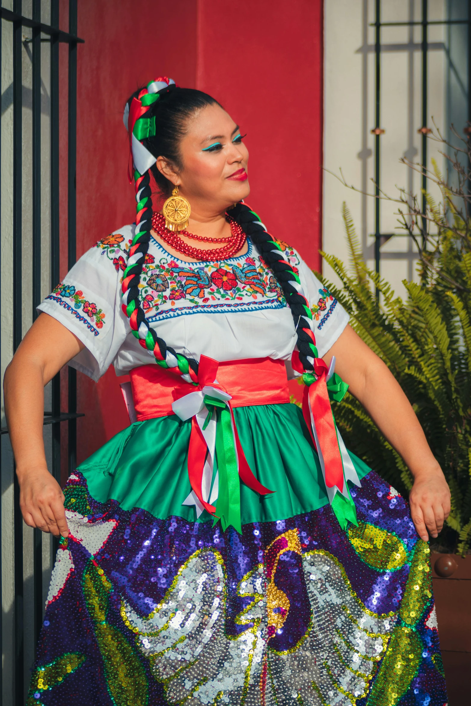 a woman in bright colors with beads and hair