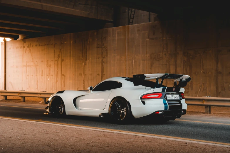 a car parked in front of a tunnel