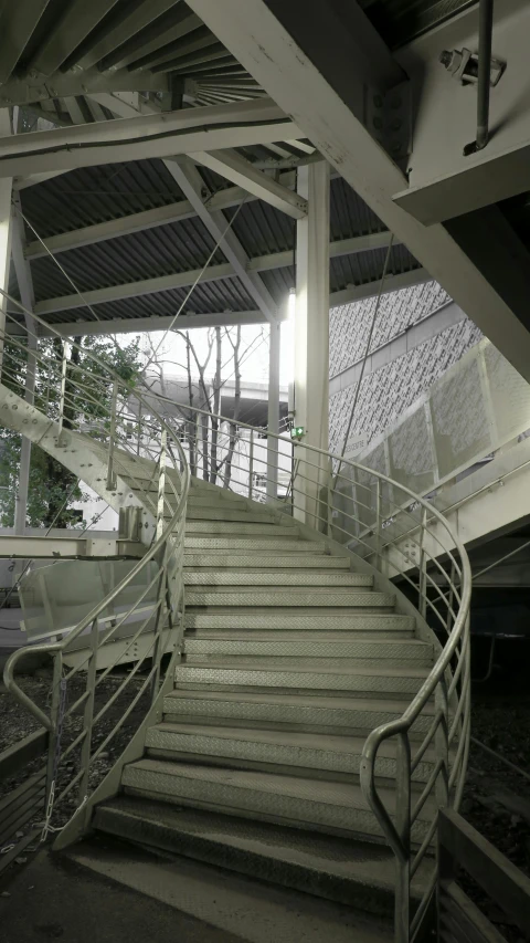 stairs with railings leading up to an outside stairwell