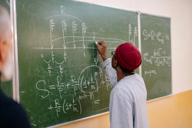 a blackboard with a few chalk writing on it