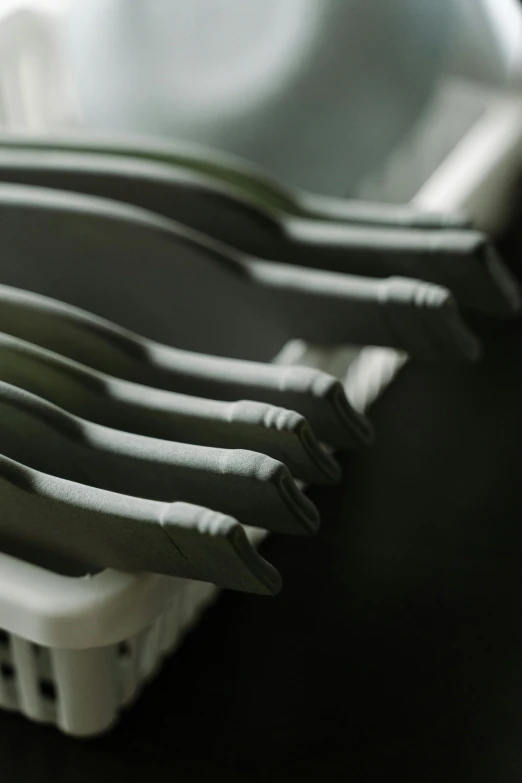 a row of knives sitting on top of a table