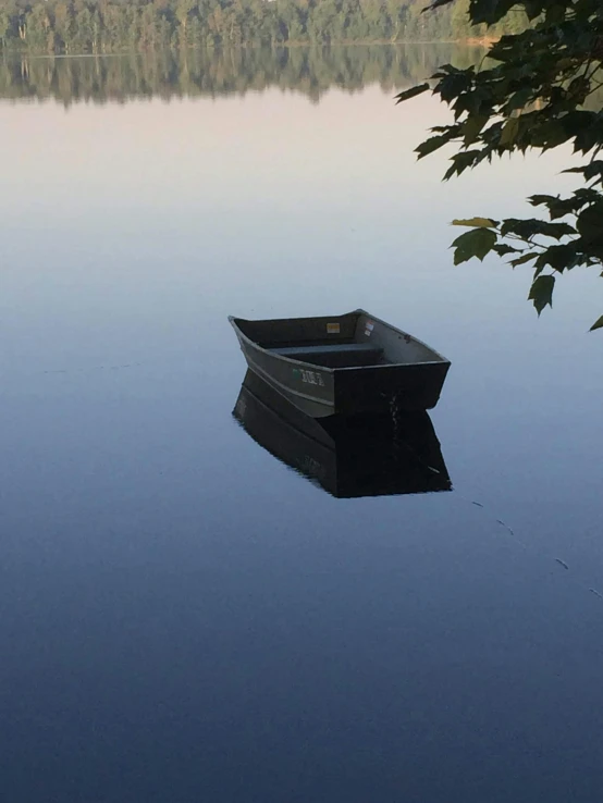 a boat floating on top of a body of water