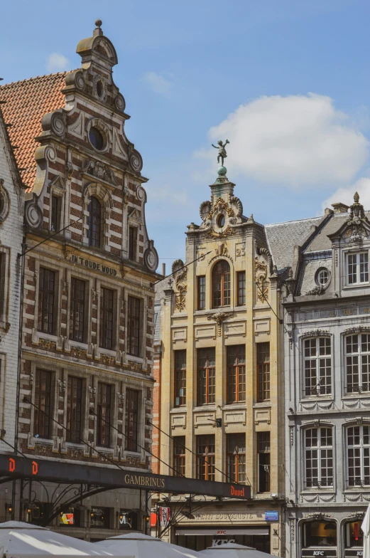 many buildings with a clock tower in the middle