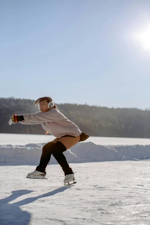 a woman skating across a large open expanse