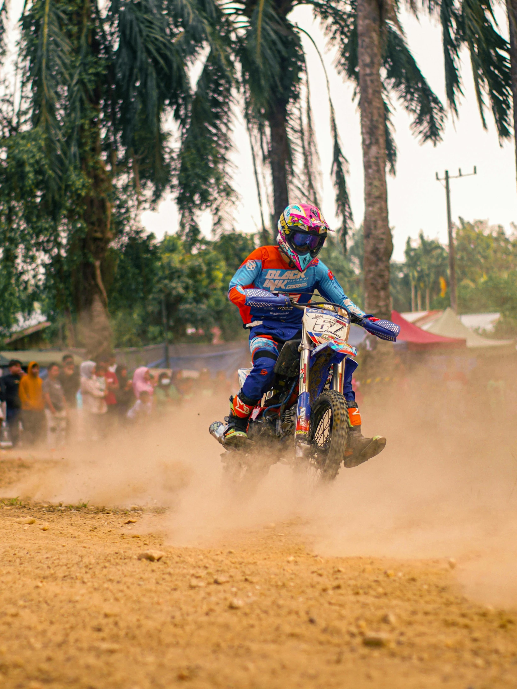 a person on a dirt bike going around a circle