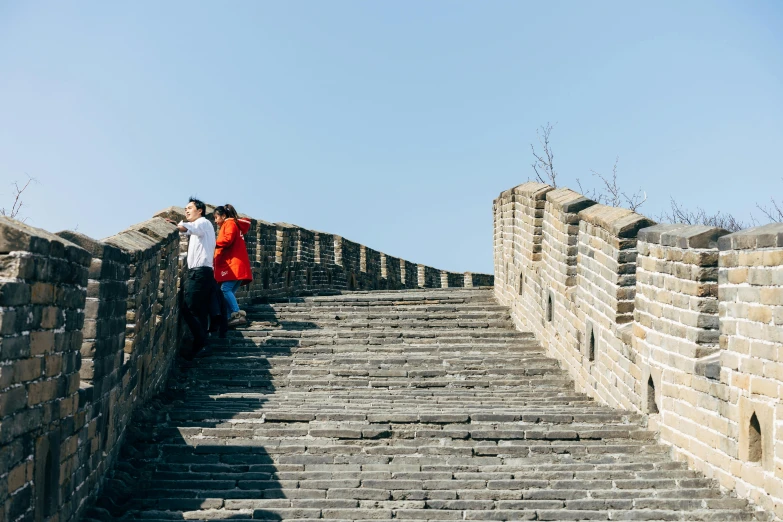 two people on the steps looking into the sky