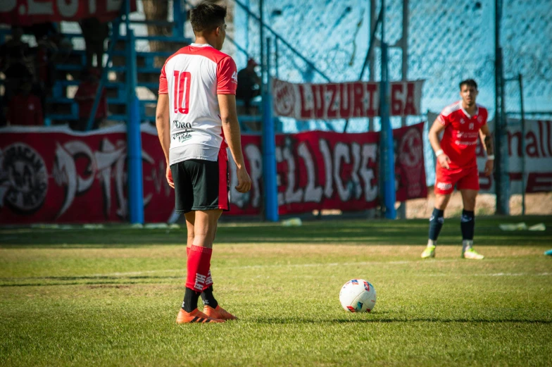 two soccer players on the field during a match