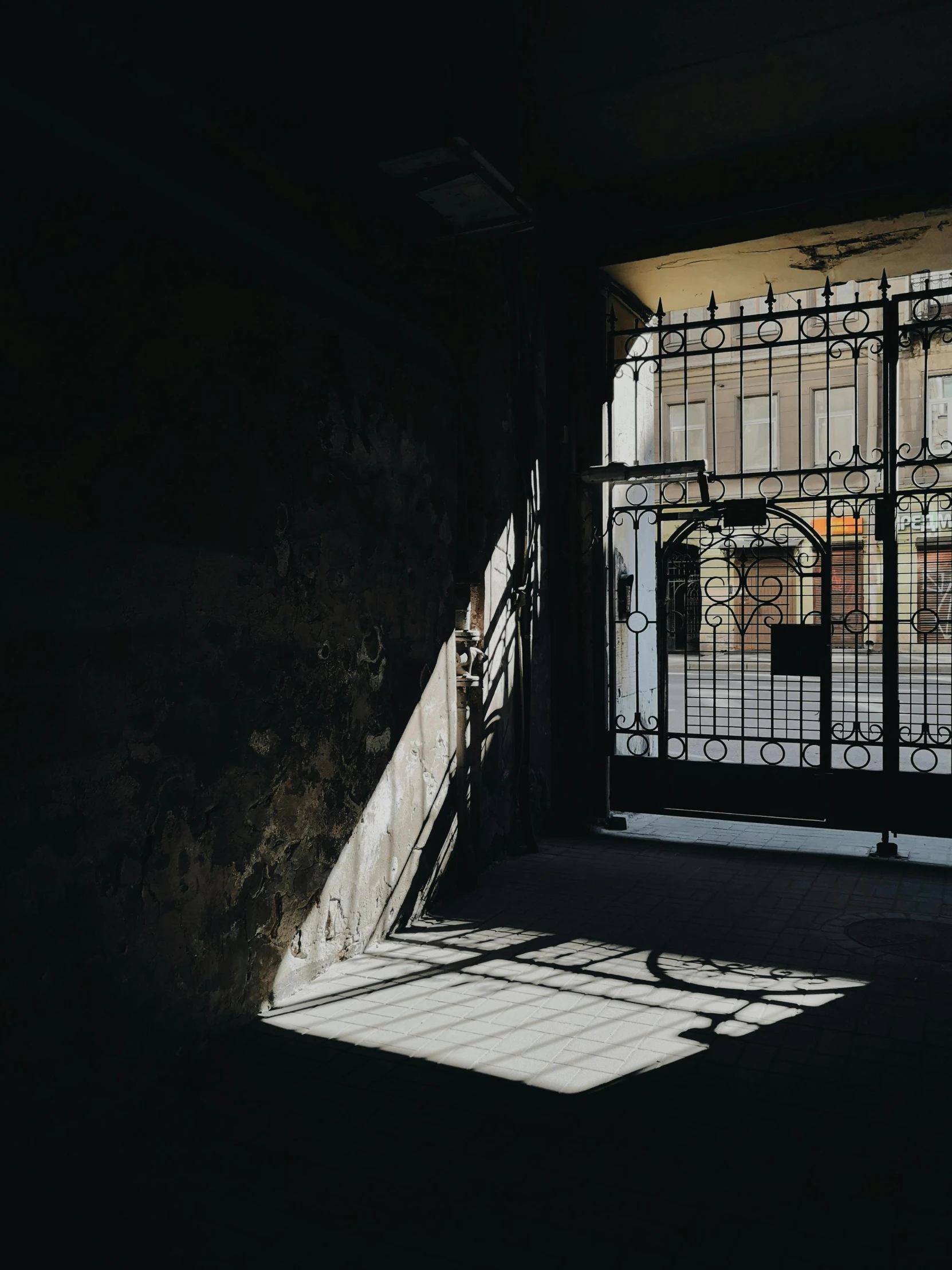 sunlight casts on an abandoned building door and window