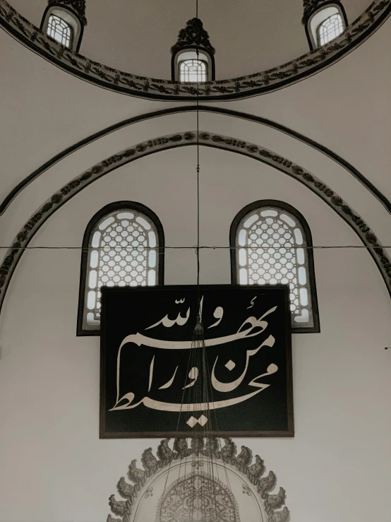 a large clock hanging from the side of a building