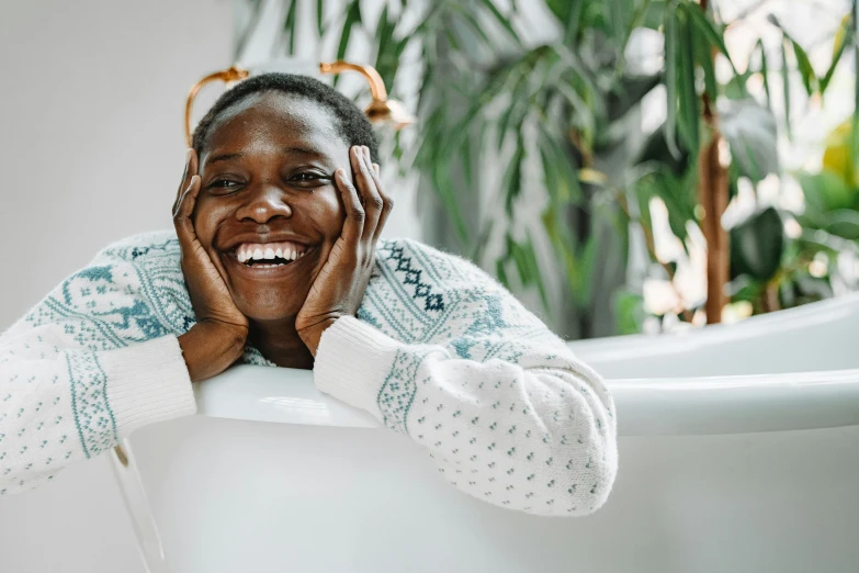 a woman has her hands on her face