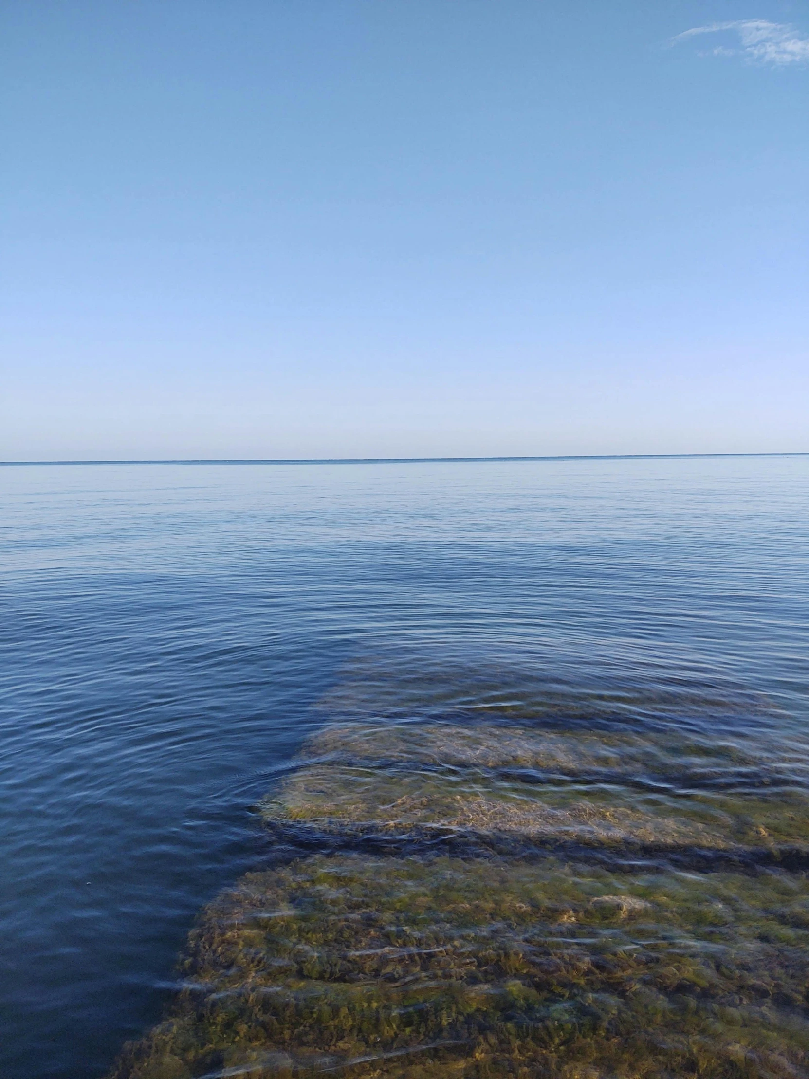 water on the edge of a channel in the middle of the ocean