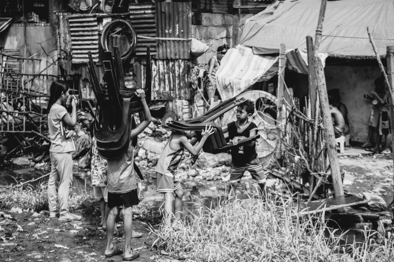 two men are standing in front of some wooden shacks