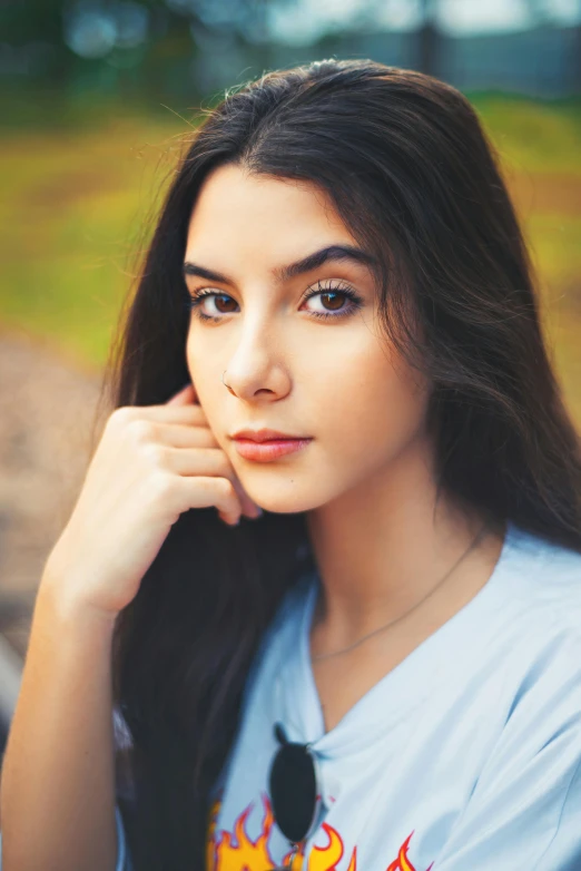 a close up of a woman wearing a shirt