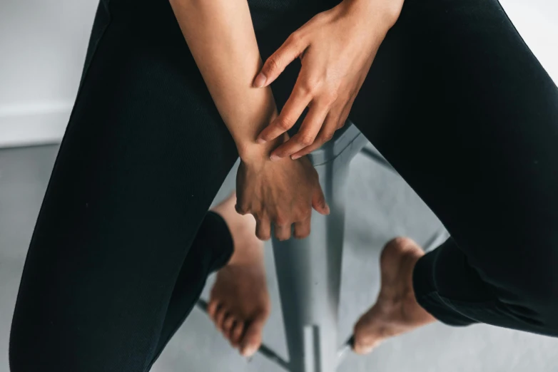 a woman stretches her legs out to stretch out