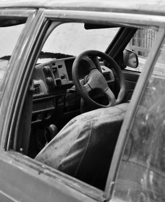 view of car from front seat on right - hand side with dashboard, steering wheel and left center dash