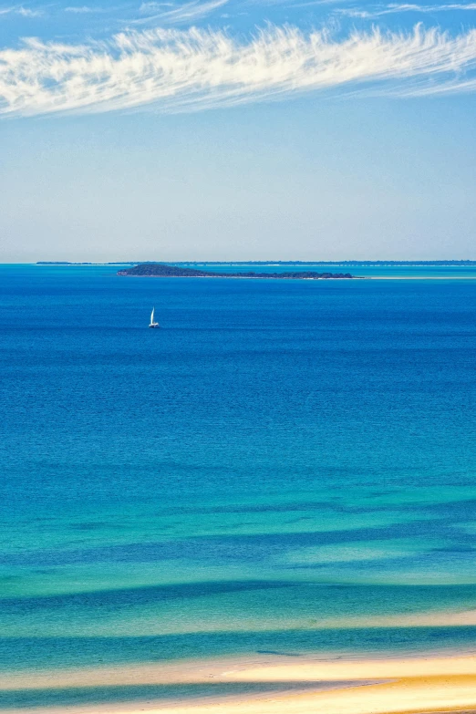 the water at the beach looks bright blue