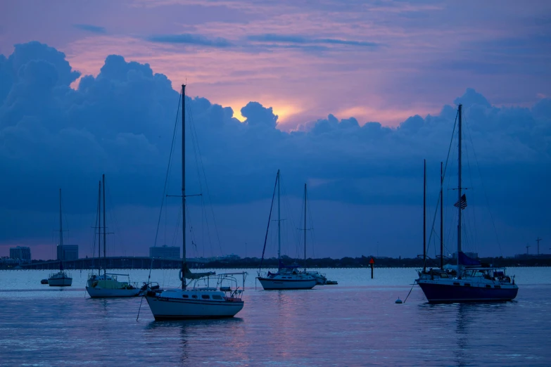 a couple of boats are sitting in the water