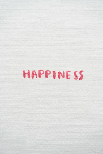 a word in red ink that says happiness on a white surface