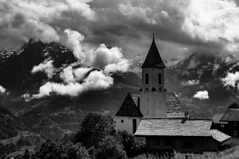 a building with a tower under cloudy skies