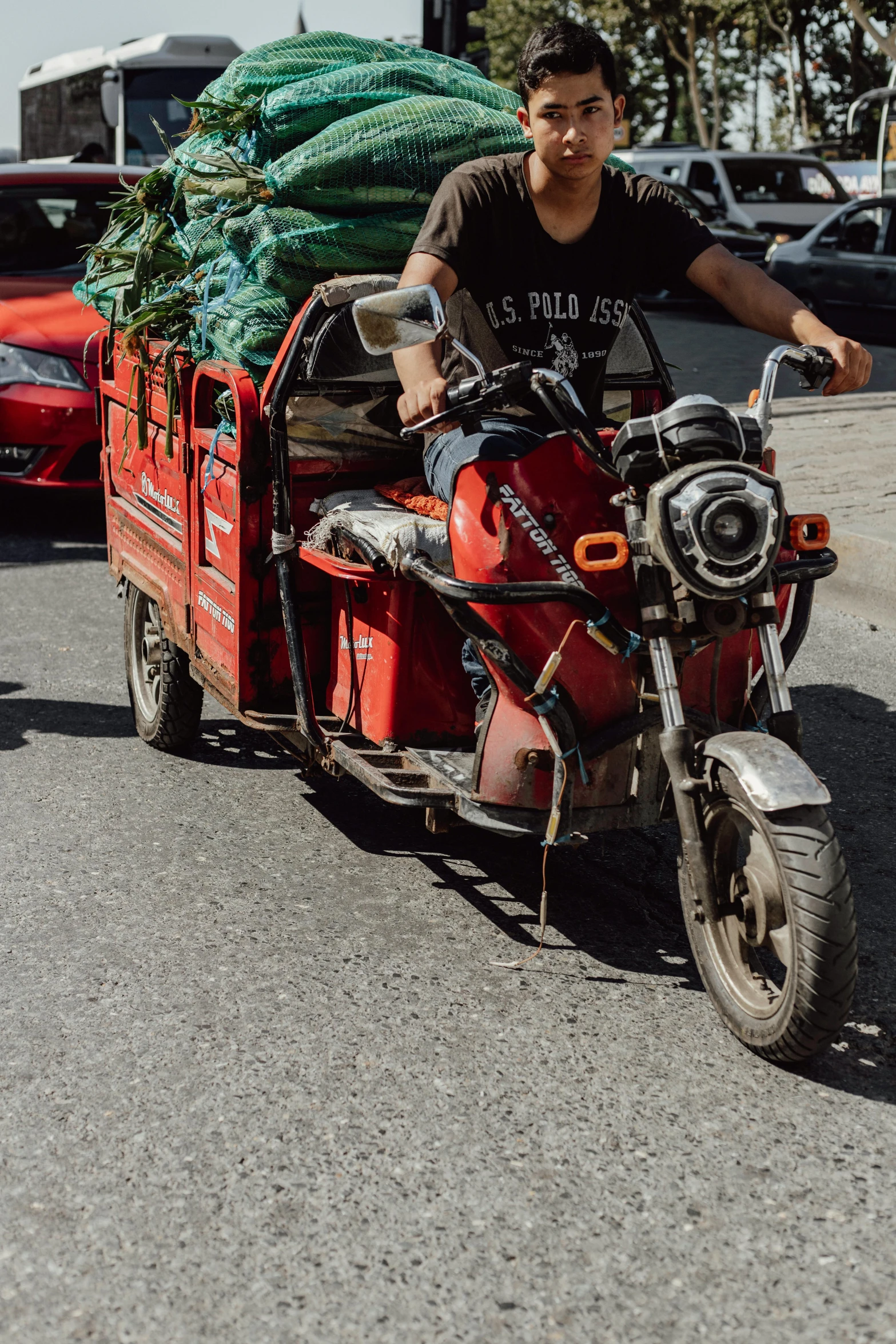 the man is riding on the back of a motorcycle with trees in it